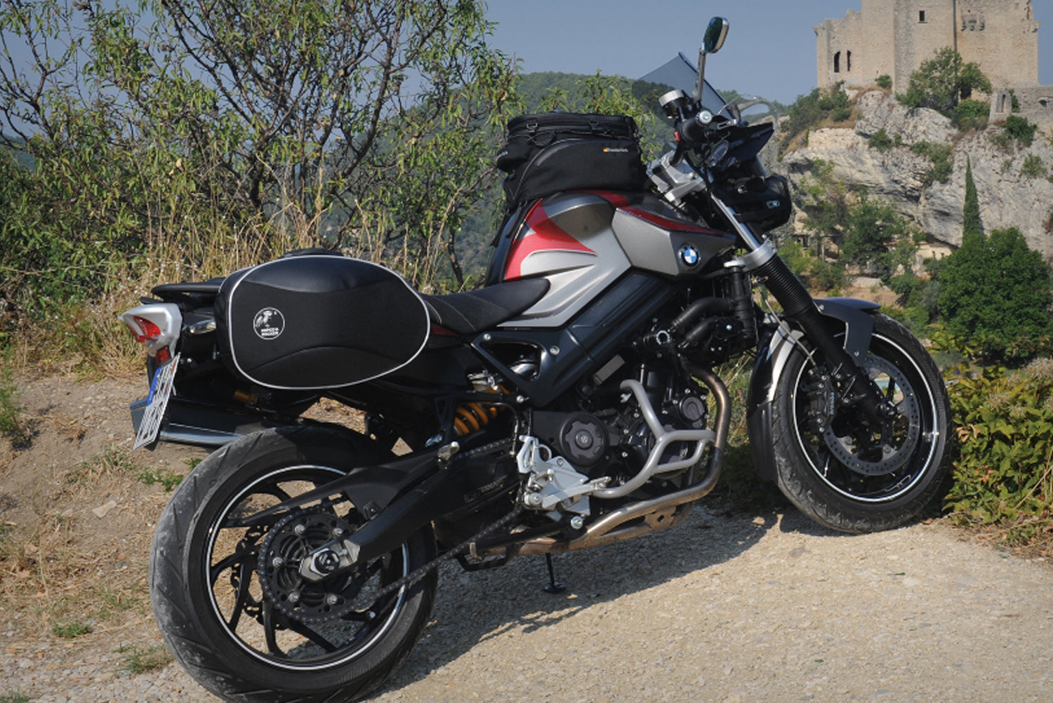 The mounting system is attached to the vehicle with minimal hand pressure and the tank bag can be quickly fastened to it.