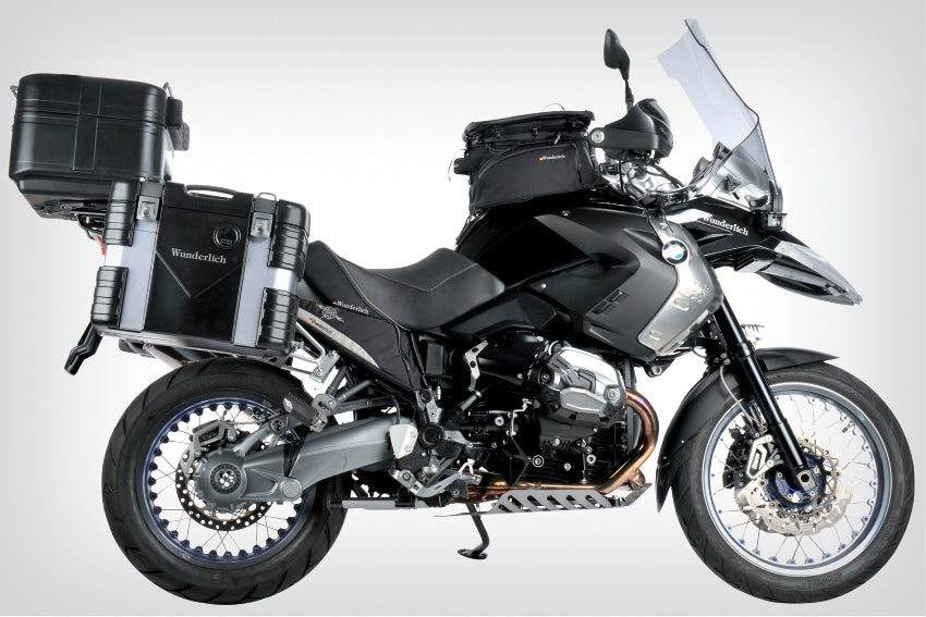 The mounting system is attached to the vehicle with minimal hand pressure and the tank bag can be quickly fastened to it.