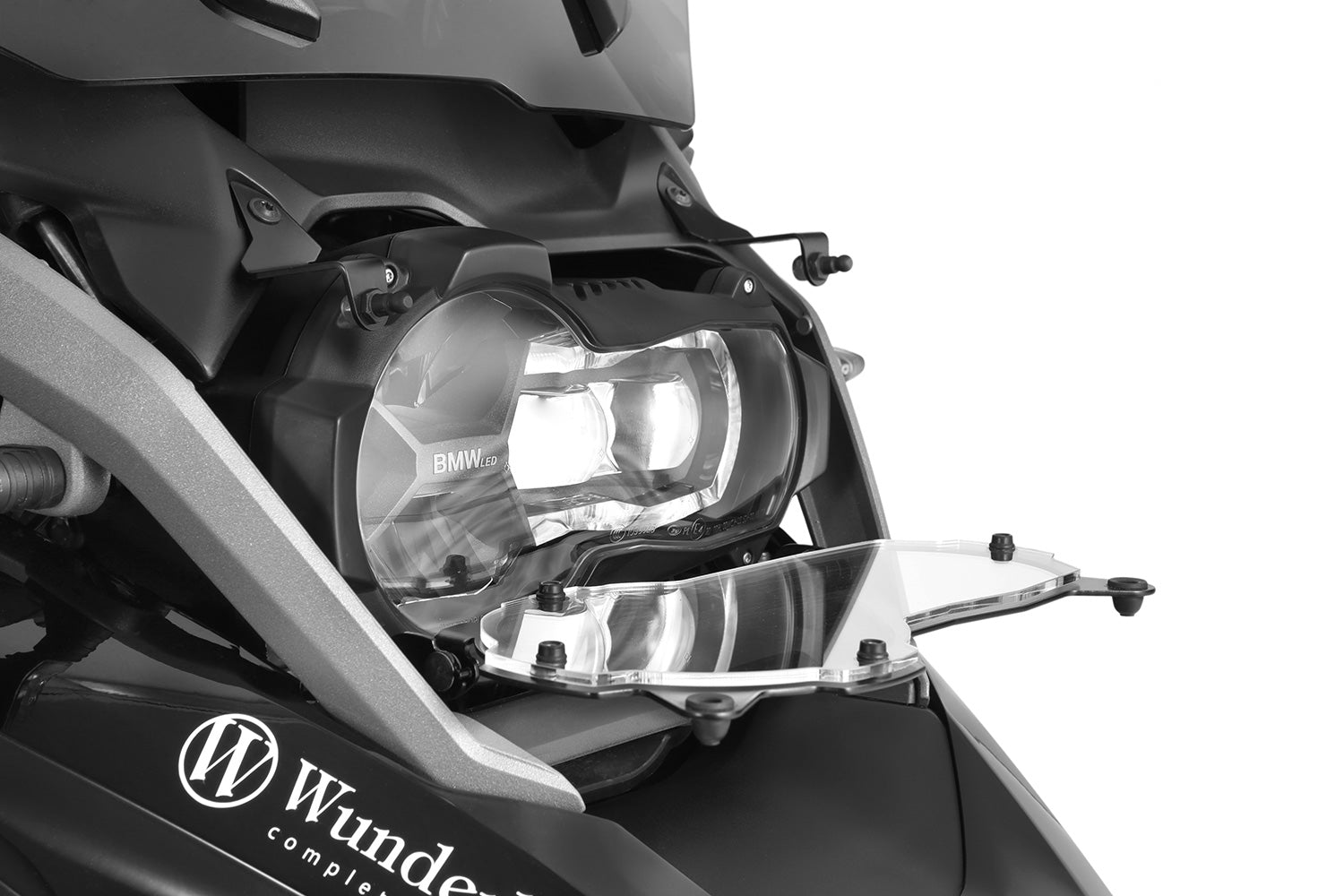 Foldable head light grille from Wunderlich provides effective protection for your bmw R 1200/1250 GS LC Adv. headlight protection.