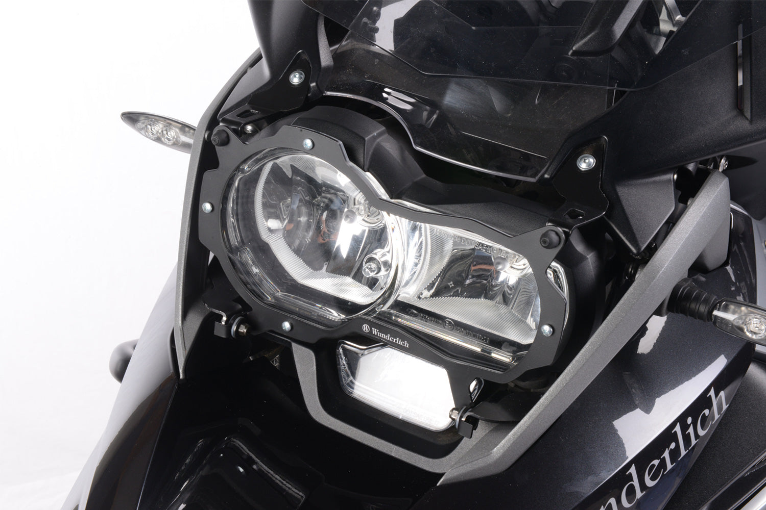 Foldable head light grille from Wunderlich provides effective protection for your bmw R 1200/1250 GS LC Adv. headlight protection.