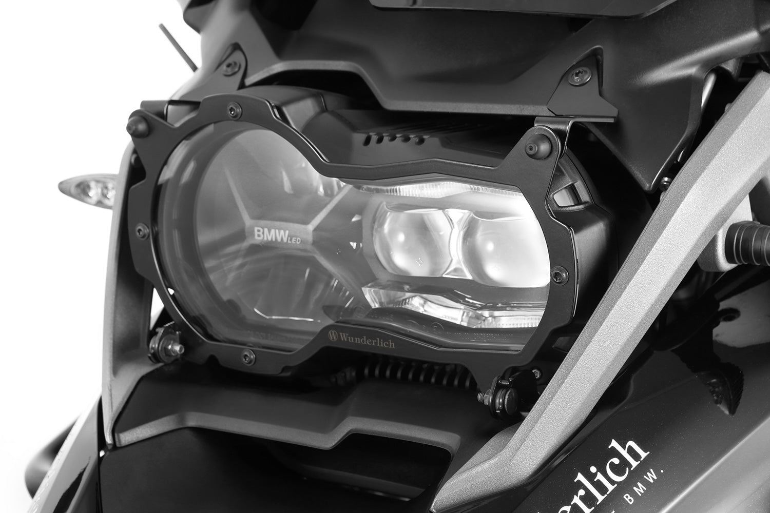 Foldable head light grille from Wunderlich provides effective protection for your bmw R 1200/1250 GS LC Adv. headlight protection.