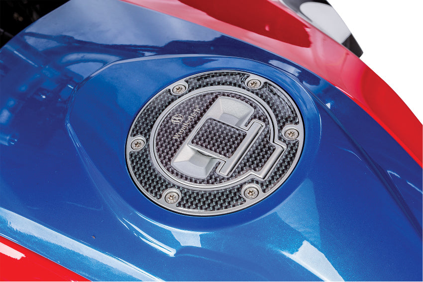 Wunderlich filler cap cover carbon look protects the filler cap cover against scratches.