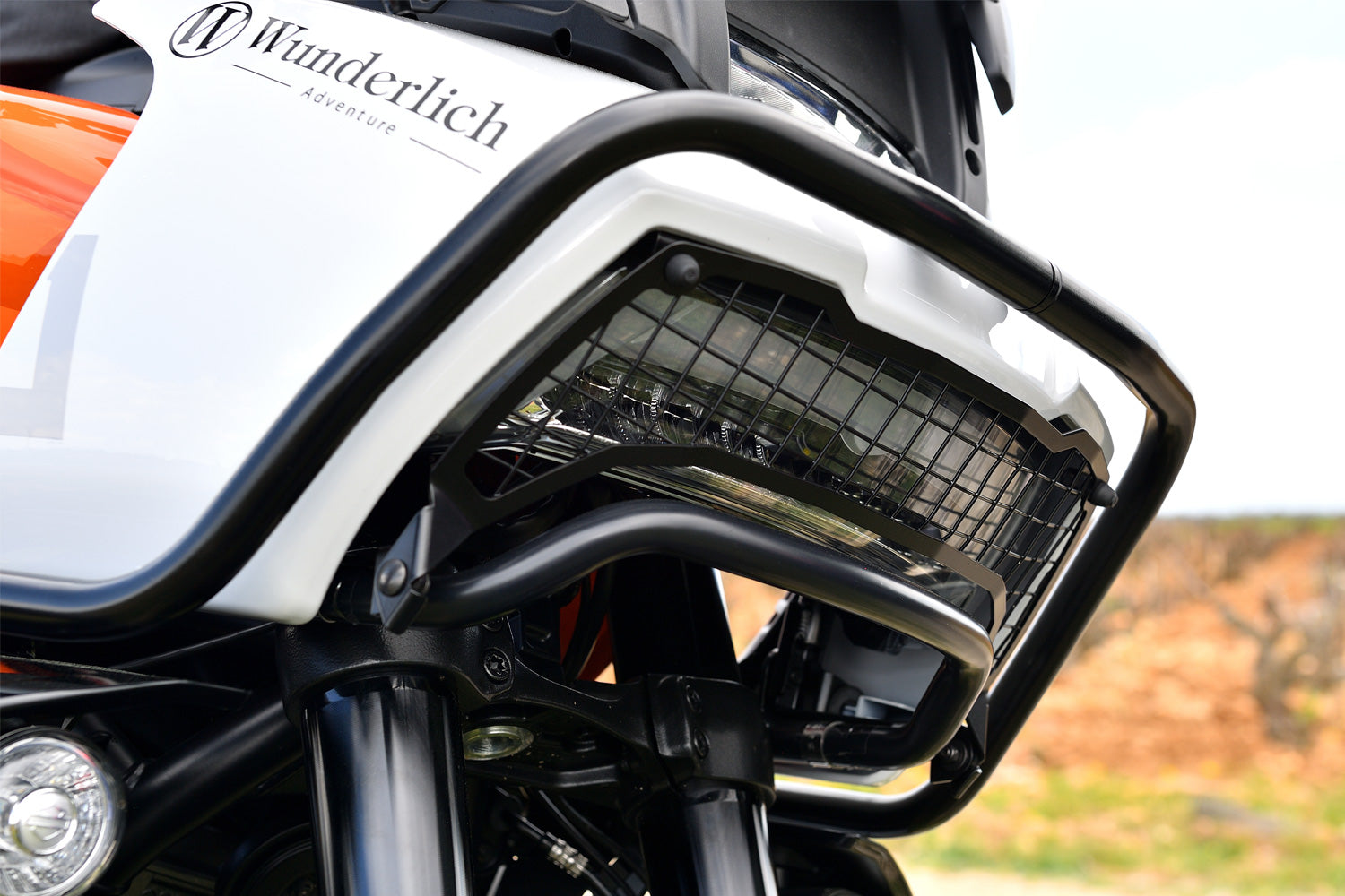 Wunderlich headlight protection grill, foldable, for the Harley-Davidson Pan America 1250 reliably protects the original headlight from...