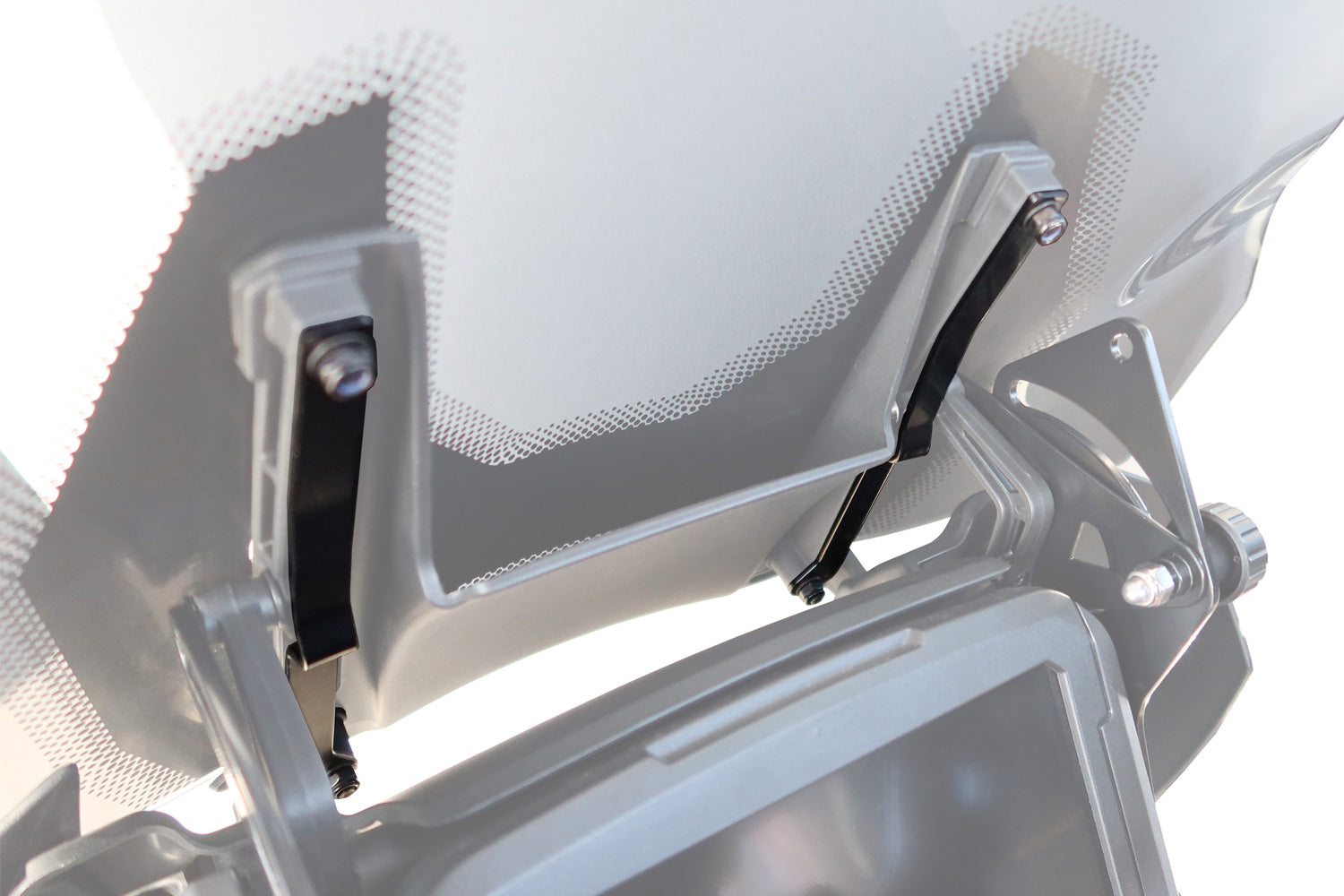 Safety plates secure the windshield and its support frame