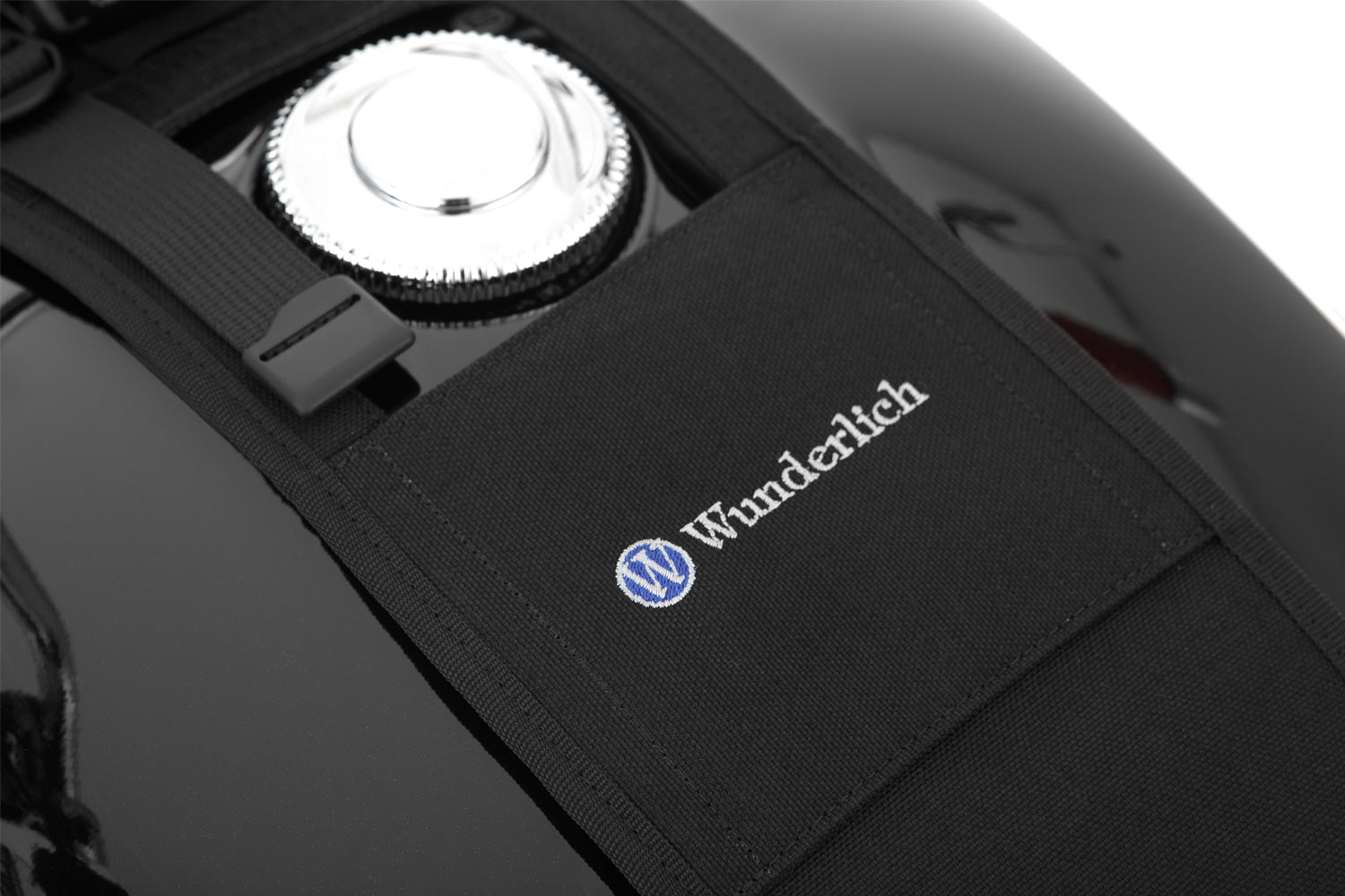 The mounting system is attached to the vehicle with minimal hand pressure and the tank bag can be quickly fastened to it. 