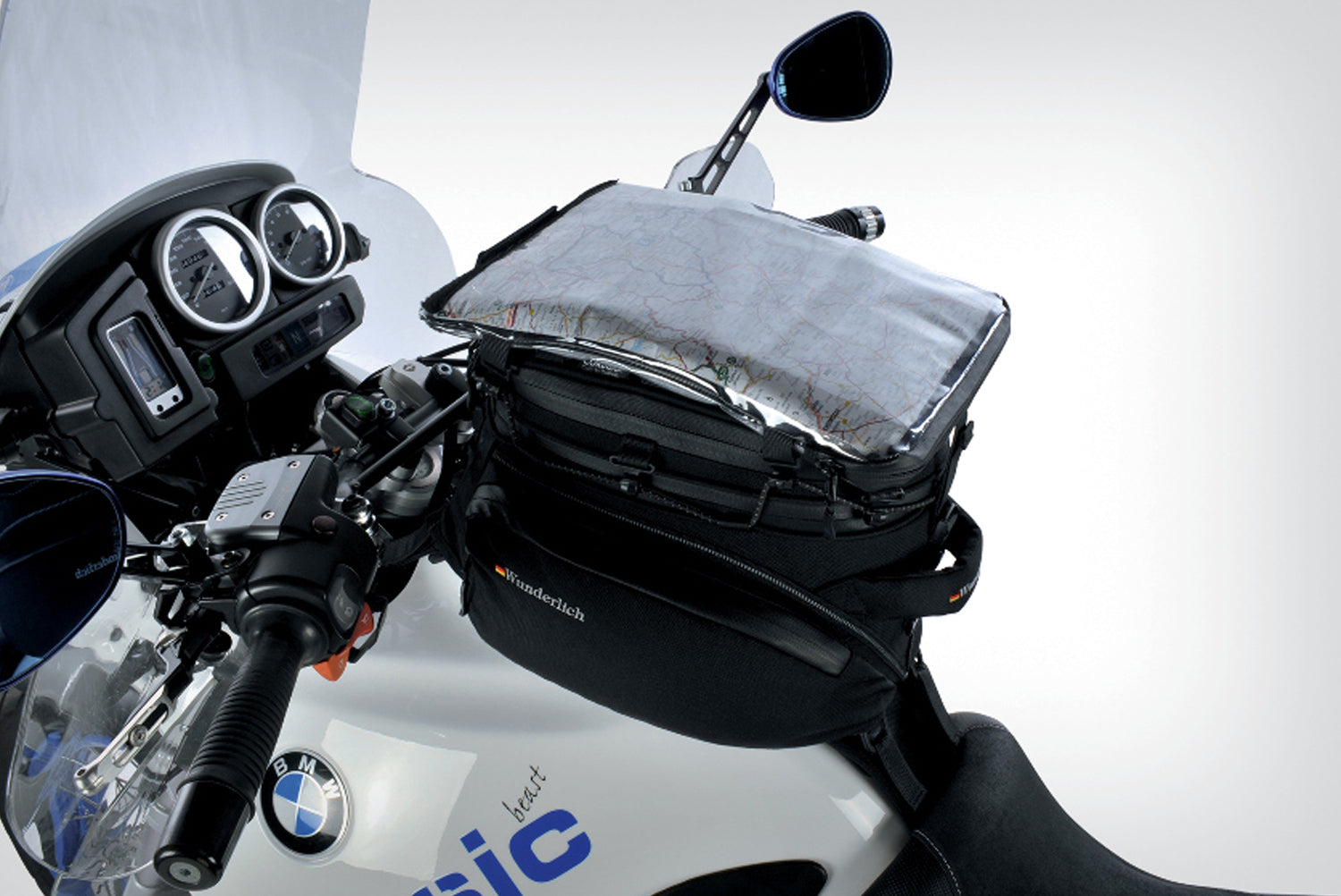 The mounting system is attached to the vehicle with minimal hand pressure and the tank bag can be quickly fastened to it. 