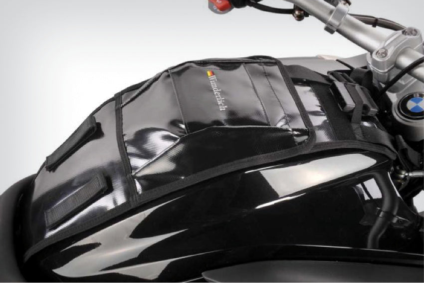 The mounting system is attached to the vehicle with minimal hand pressure and the tank bag can be quickly fastened to it. 