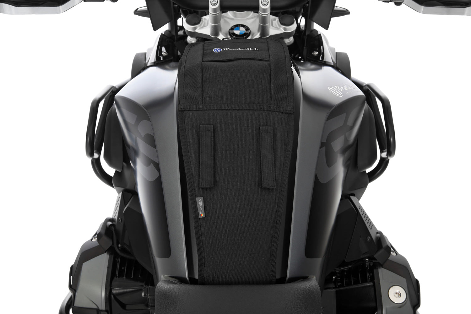 The mounting system is attached to the vehicle with minimal hand pressure and the tank bag can be quickly fastened to it. 
