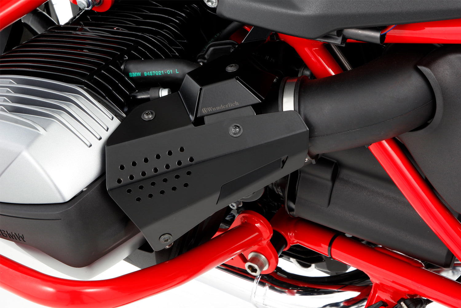 The cover of the fuel injection system protects the intake pipe area including the injector tube, line connections and throttle valve sensor