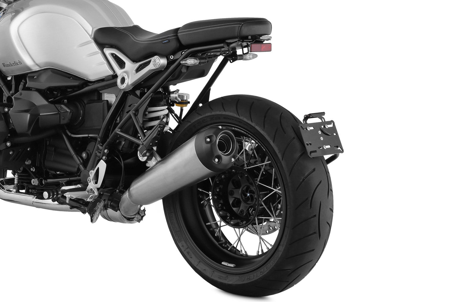 Discretely and lightweight number plate holder which integrates excellent into the sporty line of the Roadster