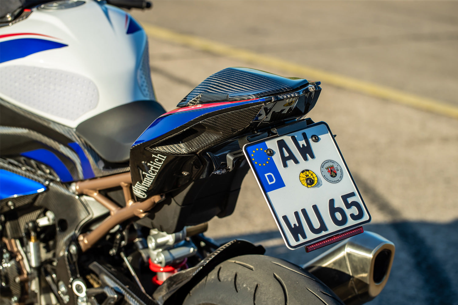 The set includes two high-quality indicator brackets made of black anodised aluminium