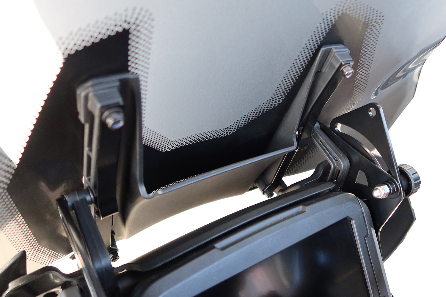 Safety plates secure the windshield and its support frame